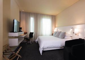 Ένα ή περισσότερα κρεβάτια σε δωμάτιο στο Movich Hotel Las Lomas