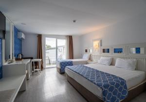 Postel nebo postele na pokoji v ubytování Amara Comfort Resort + 37 fotografií