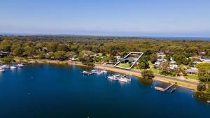 an aerial view of a lake with boats in it at Sunset House in Raymond Island