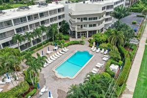 an aerial view of the pool at the resort at Relaxing inland condo with pool and steps to beach in Marco Island