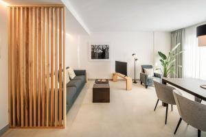 a living room with a couch and a table at Panasco Suites in Arrecife