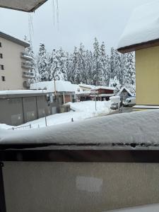 a view from a window of a snow covered yard at Elite Apartments Complex Iglika Borovets in Borovets