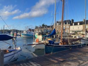 a group of boats docked in a harbor at Chez David à Paimpol in Paimpol