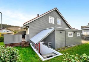 a large house with a large garage at Granåsen World Championship Stay Walk to Ski Arena in Trondheim