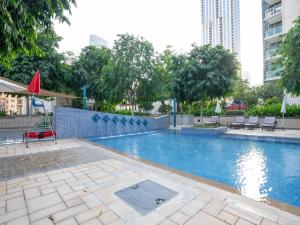 Bazén v ubytování Holidays R Us villa 3 bedroom premium location nebo v jeho okolí