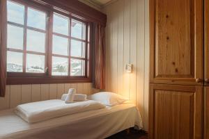 Postel nebo postele na pokoji v ubytování Fanitullen Apartments