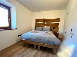 Ένα ή περισσότερα κρεβάτια σε δωμάτιο στο Casa Al Castagneto