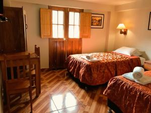 Nafis Casona Apu Linli Pisac客房内的一张或多张床位