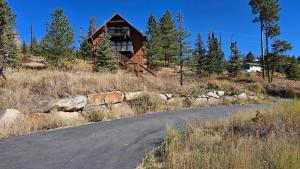 a house on a hill next to a road at Palmers Dr 1010 in Silverthorne