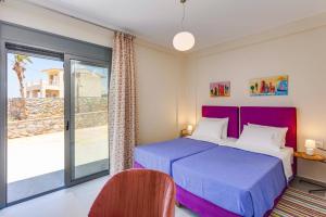 Ένα ή περισσότερα κρεβάτια σε δωμάτιο στο Villa Kastalia by Villa Plus +19 φωτογραφίες