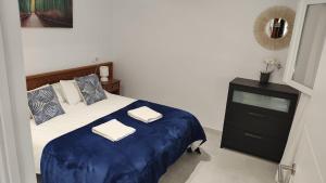 Ein Bett oder Betten in einem Zimmer der Unterkunft Cala Ferrera HOME&ME