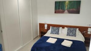 Ein Bett oder Betten in einem Zimmer der Unterkunft Cala Ferrera HOME&ME