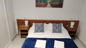 Ein Bett oder Betten in einem Zimmer der Unterkunft Cala Ferrera HOME&ME