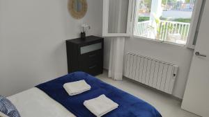 Ein Bett oder Betten in einem Zimmer der Unterkunft Cala Ferrera HOME&ME