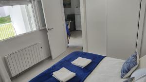 Ein Bett oder Betten in einem Zimmer der Unterkunft Cala Ferrera HOME&ME