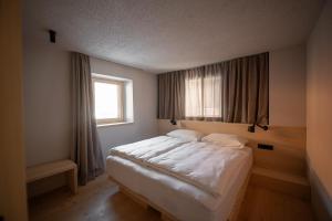 Postelja oz. postelje v sobi nastanitve Calva B&B Apartments