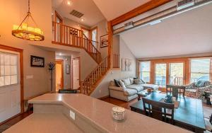 a living room with a couch and a table at Your Gateway to Pocono! in Tannersville