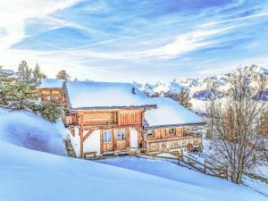 a house covered in snow in the mountains at Chalet Gingembre 8 by Interhome in Nendaz
