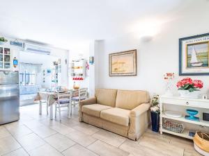 a living room with a couch and a table at Holiday Home Les Parcs de Gassin-1 by Interhome in Saint-Tropez