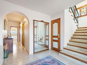 a hallway with stairs and a mirror at Villa Moraira Magica by Interhome in Moraira +37 photos