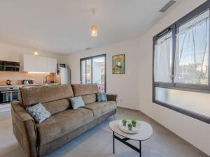 a living room with a couch and a table at Apartment Collioure le haut-1 by Interhome in Collioure