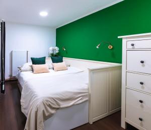 A bed or beds in a room at Budapest Downtown Museum Apartments