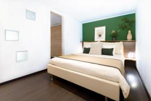 A bed or beds in a room at Budapest Downtown Museum Apartments