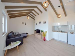 a living room with a couch and a table at Holiday Home Brankovi Dvori by Interhome in Prigradica