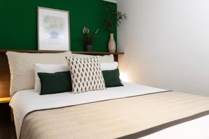 A bed or beds in a room at Budapest Downtown Museum Apartments