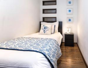 A bed or beds in a room at Budapest Downtown Museum Apartments