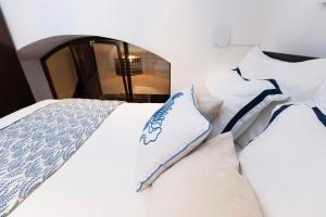 A bed or beds in a room at Budapest Downtown Museum Apartments