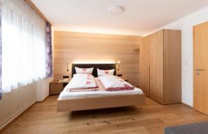 Postel nebo postele na pokoji v ubytování Gästehaus Manuela Puchmayr + 37 fotografií