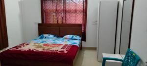 Postel nebo postele na pokoji v ubytování Snowdrop inn coorg