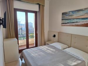 Postel nebo postele na pokoji v ubytování Hotel La Margherita & SPA
