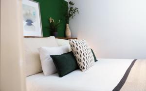 A bed or beds in a room at Budapest Downtown Museum Apartments