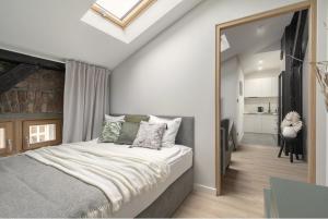 Ένα ή περισσότερα κρεβάτια σε δωμάτιο στο INN Home - Warszawska