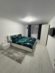 Postel nebo postele na pokoji v ubytování Apartament Acasă în Bucovina + 1 fotografie