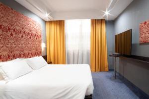 Telewizja i/lub zestaw kina domowego w obiekcie Hotel IMPERATORI