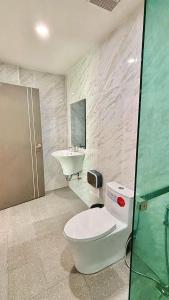 a bathroom with a toilet and a sink at The zign in Ko Yao Yai
