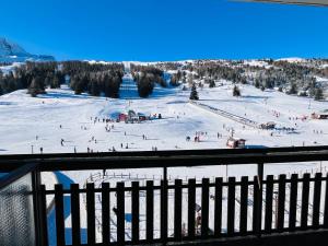 a group of people skiing on a ski slope at Pause montagnarde in Le Dévoluy