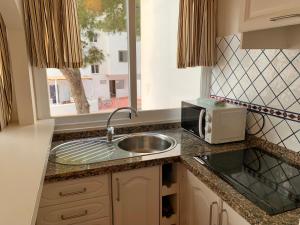 Dapur atau dapur kecil di Apartamentos Rex, con due camere da letto