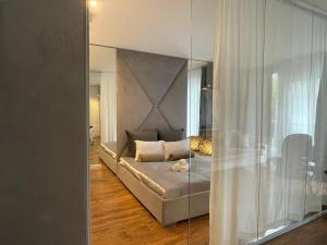 a bedroom with a bed with a mirrored wall at AHOp in Wrocław