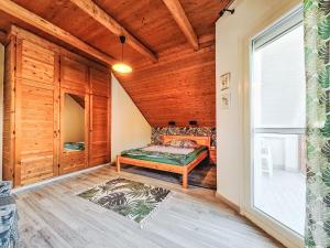 a bedroom with a bed in a room with a window at Apartment Bonika by Interhome in Fonyód +26 photos