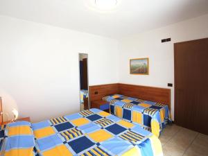 En eller flere senge i et værelse på Holiday Home La Quercia-1 by Interhome