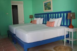 Letto o letti in una camera di Sugarapple Bequia