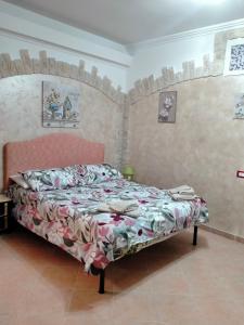 a bedroom with a bed in a room at Casa Flasia in Capranica +8 photos