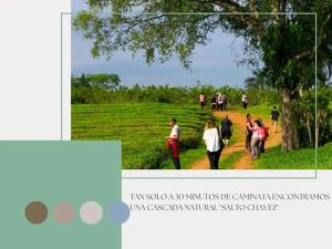 a group of people walking down a dirt road at Camping Caitano in Campo Grande