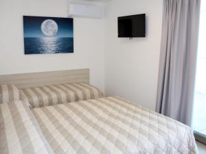 Ένα ή περισσότερα κρεβάτια σε δωμάτιο στο Apartment Nashira-3 by Interhome