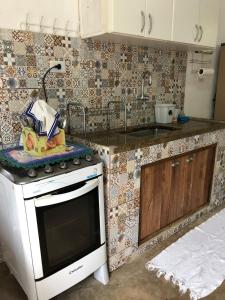 Kuchyň nebo kuchyňský kout v ubytování hostel do Mineiro São Bento Sapucaí 2