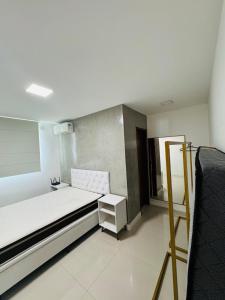 Ένα ή περισσότερα κρεβάτια σε δωμάτιο στο Casa de Alto Padrão em Unamar Cabo Frio +19 φωτογραφίες